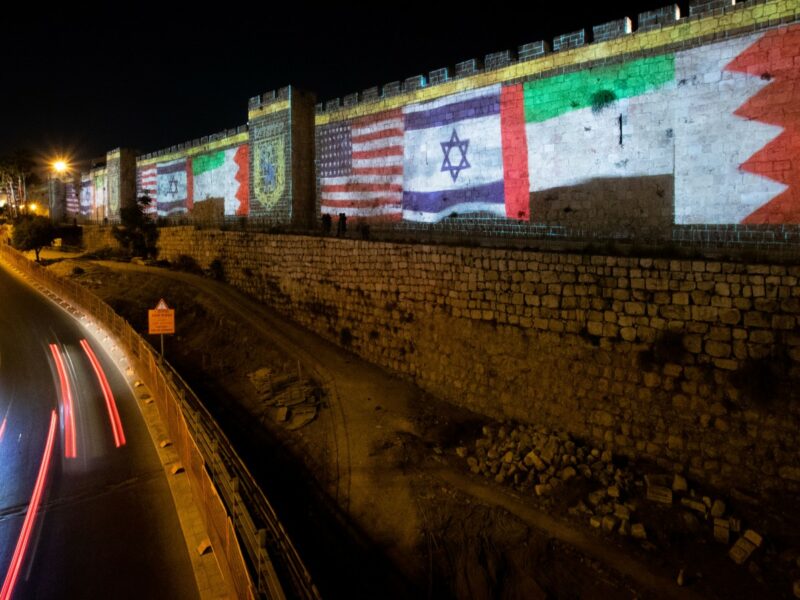 The Flags of US, United Arab Emirates, Israel & Bahrain are screened on the walls of Jerusalem's Old City