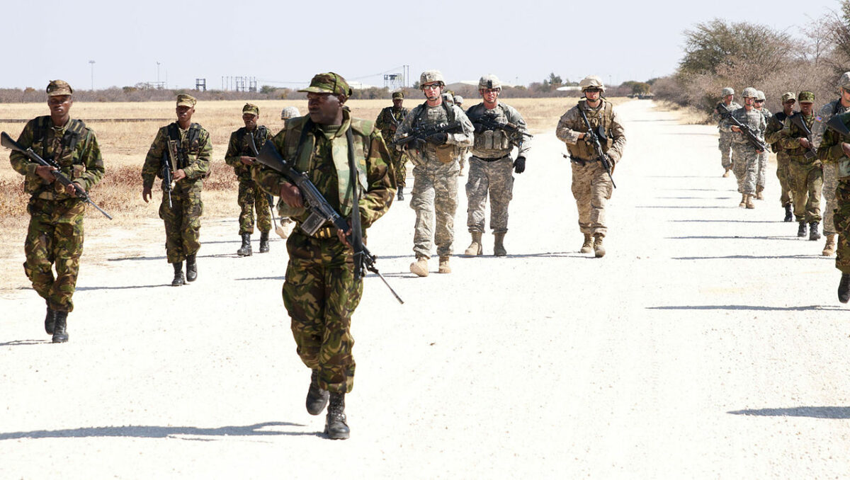 Cpl. Mmolawa Kgabo leads an element composed of fellow Botswana Defense Force members, Army Soldiers from the 1st Battalion 114th infantry company and Marines from Co. D Anti- Terrorism Battalion 4th Marine Division, on a training exercise designed to let them set up and carry out an ambush against fellow class mates.