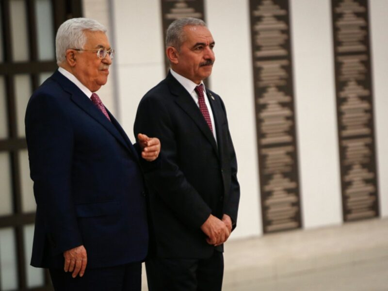 Palestinian Authority leader Mahmoud Abbas (left) and P.A. Prime Minister Mohammad Shtayyeh at the swearing-in ceremony of the new government at the P.A.'s headquarters in Ramallah, April 13, 2019.