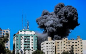Smoke rising from the Al-Jalaa tower in Gaza after an Israeli airstrike on the building, which housed Hamas operatives and several media outlets, including the "Associated Press" and "Al Jazeera," May 15, 2021. Photo by Atia Mohammed/Flash90.