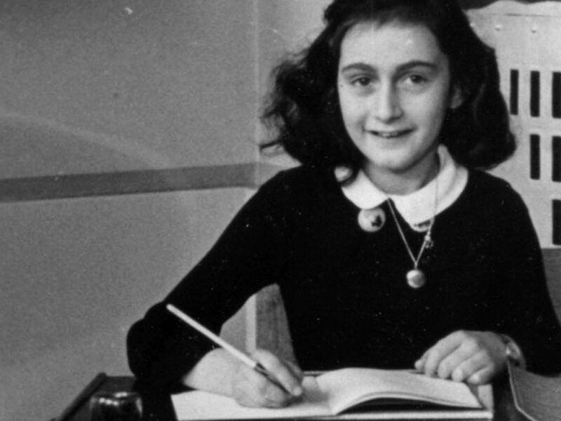 Anne Frank, age twelve, at her school desk. Amsterdam, the Netherlands, 1941. (Anne Frank Stichting)