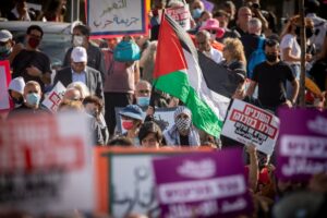 Palestinians and left-wing activists protest in the eastern Jerusalem neighborhood of Sheikh Jarrah. April 16, 2021. Photo by Yonatan Sindel/Flash90.