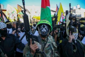 Palestinians from the al-Aqsa Martyrs Brigades of the Fatah movement participate in a rally of support for the Palestinian president Abbas, in Halhoul, 27 June 2021. Photo by Wissam Hashlamoun/Flash90