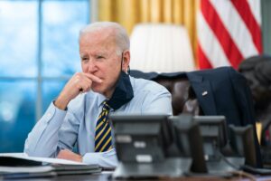 U.S. President Joe Biden participates in a conference phone call in the Oval Office of the White House on Feb. 16, 2021. Credit: Official White House Photo by Lawrence Jackson.