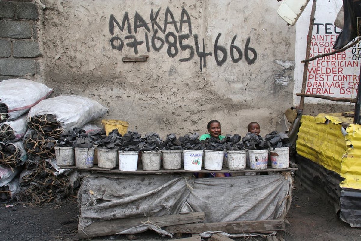 A woman sells charcoal in Nairobi, Kenya. Flickr, Laura Rantanen