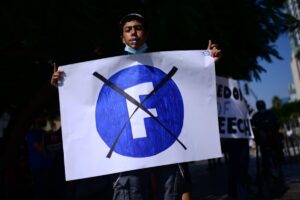 Protesters demonstrate outside the Facebook company branch in Tel Aviv on July 15, 2021. Photo by Tomer Neuberg/Flash90.