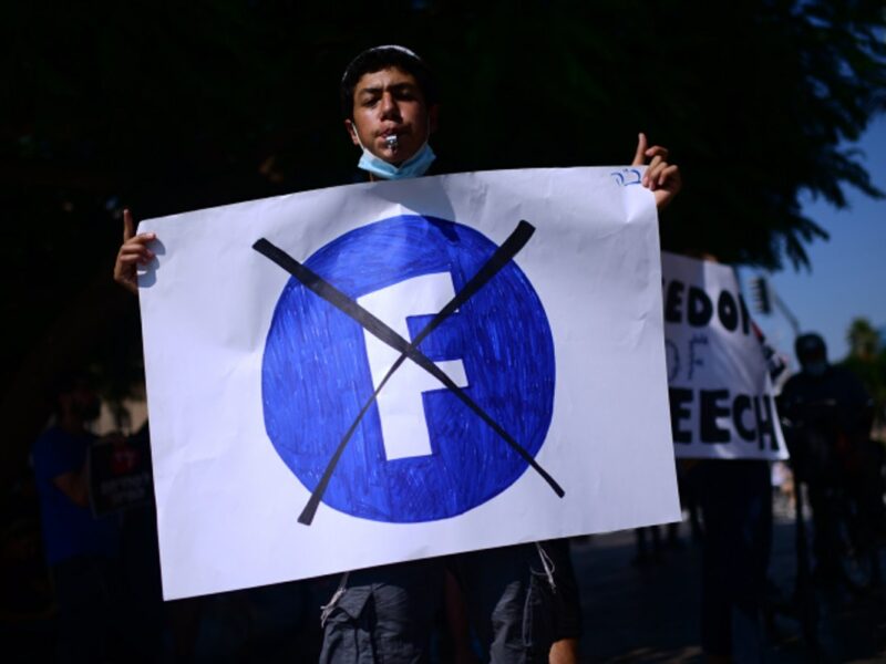 Protesters demonstrate outside the Facebook company branch in Tel Aviv on July 15, 2021. Photo by Tomer Neuberg/Flash90.