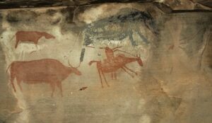 Painting of a raider on horseback (bottom right) with a musket and domestic stock. A ‘rain-animal’ (top right) was likely summoned to wash away the raiders’ tracks. Courtesy of Sam Challis and Brent Sinclair-Thomson