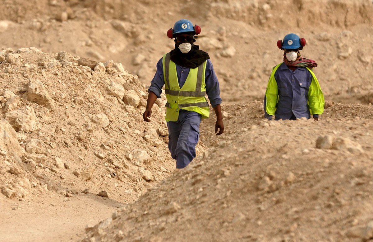 In this file photo taken during a government-organized media tour, workers walk back to the Al-Wakra Stadium worksite being built for the 2022 World Cup, in Doha, Qatar. (AP Photo/Maya Alleruzzo, File)