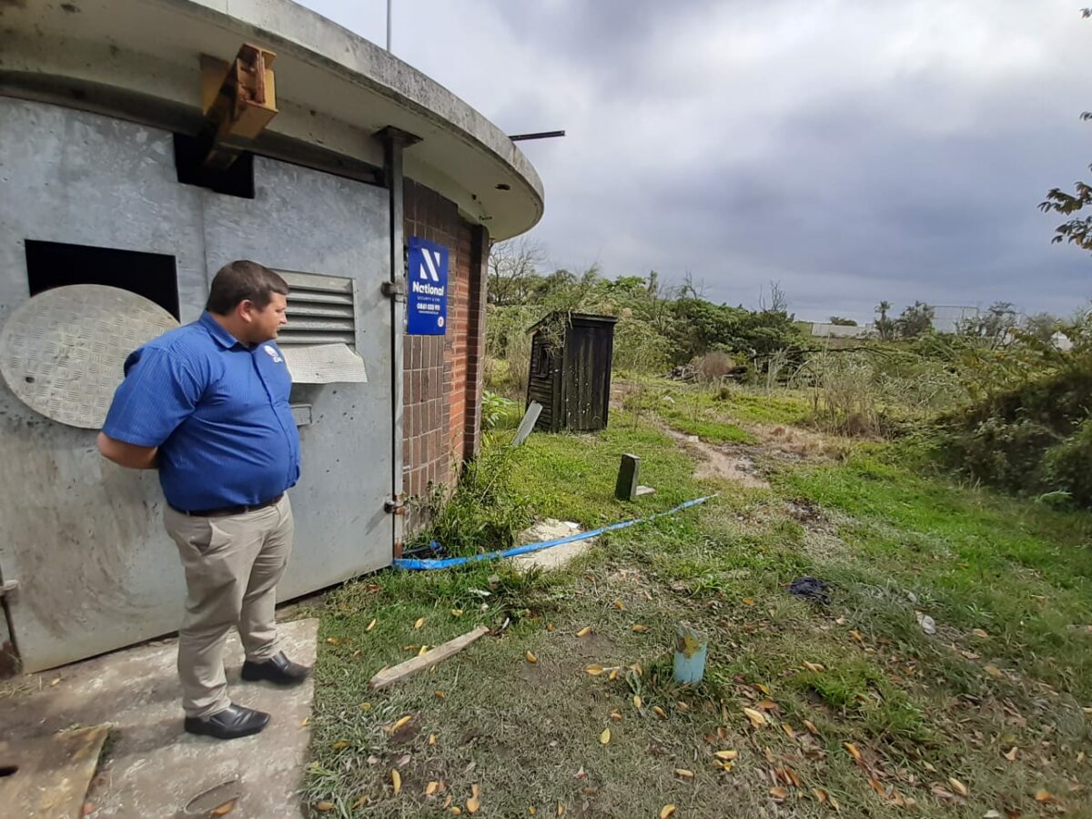Councillor Henning De Wet, Chief Whip of the Democratic Alliance caucus in City of uMhlathuze, Richard's Bay, KZN, stands in front of a broken pump station. The blue pipe simply overflows sewerage out of the station, contaminating water and surroundings. Courtesy: Heinz de Boer, MPL, DA.