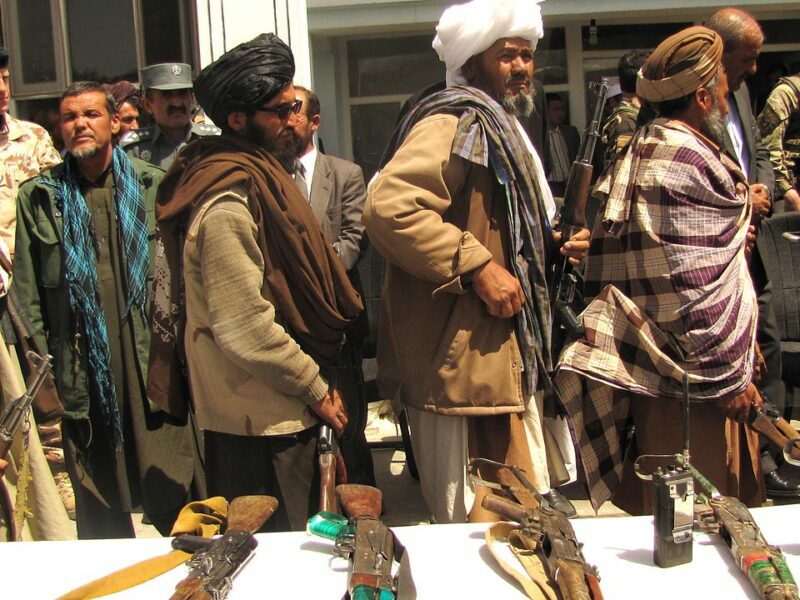 GHŌR, Afghanistan (May 28, 2012) – Former Taliban fighters line up to handover their Rifles to the Government of the Islamic Republic of Afghanistan during a reintegration ceremony at the provincial governor’s compound. The re-integrees formally announced their agreement to join the Afghanistan Peace and Reintegration Program during the ceremony. (Department of Defense photograph by Lt. j. g. Joe Painter/RELEASED).