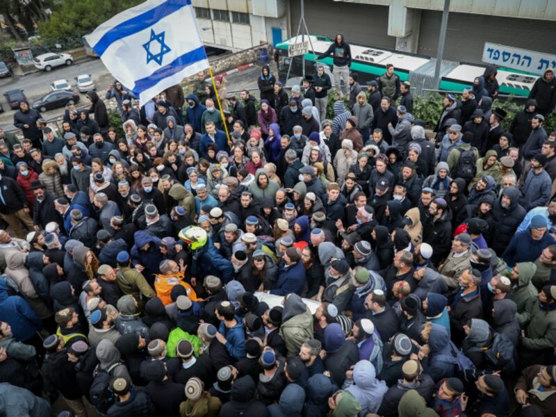 Family and friends attend the funeral of Yehuda Dimentman at Har HaMenuchot Cemetery in Jerusalem, on Dec. 17, 2021. Photo by Noam Revkin Fenton/Flash90.