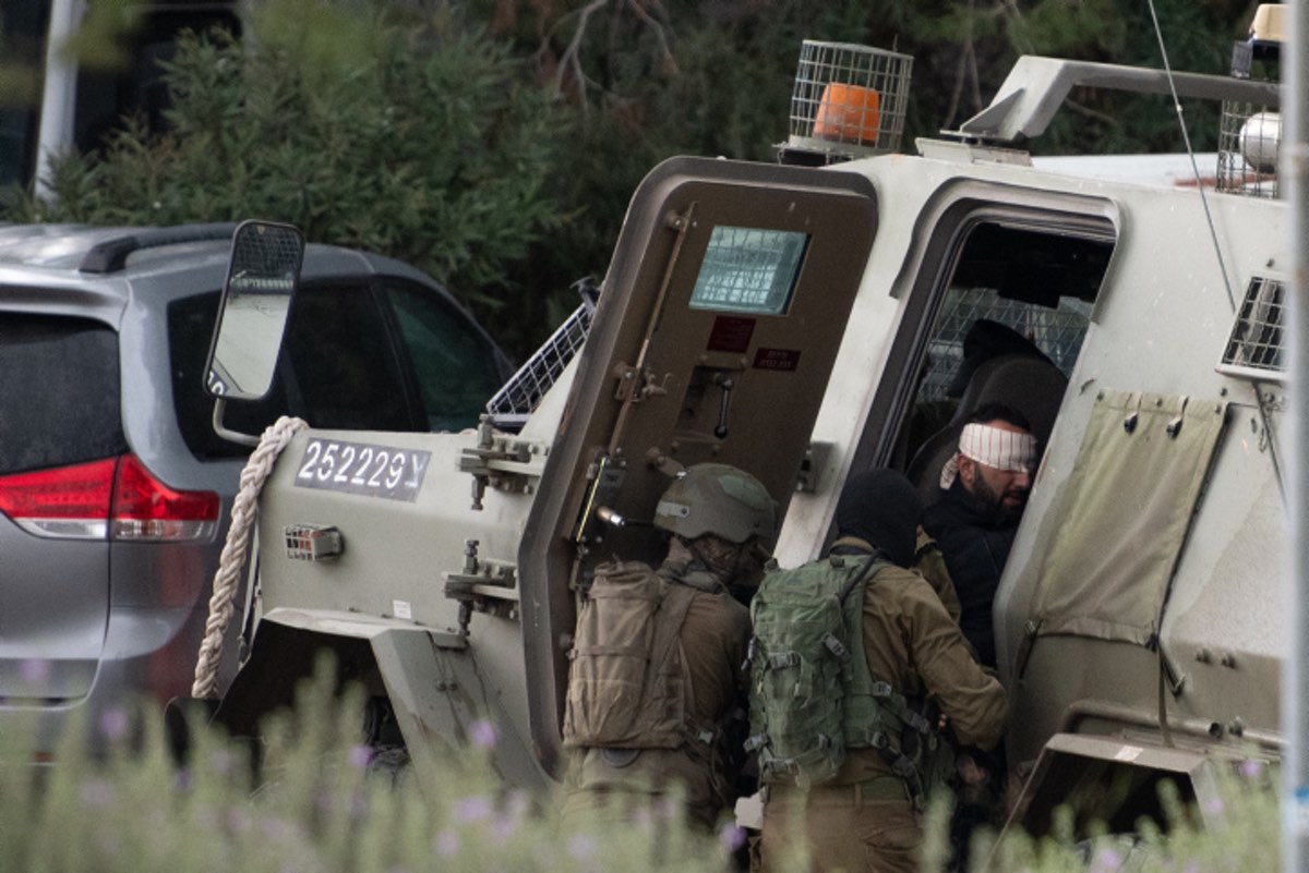 Israeli special forces arrest a Palestinian man outside Shavei Shomron, in Judea and Samaria, on Dec. 17, 2021, following a fatal terror attack near Homesh the night before. Photo by Sraya Diamant/Flash90.