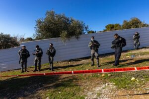 Israel Police forces guard the house in the Sheikh Jarrah neighborhood of eastern Jerusalem, whose squatter residents would be evicted two days later, Jan. 17, 2022. Photo by Olivier Fitoussi/Flash90.