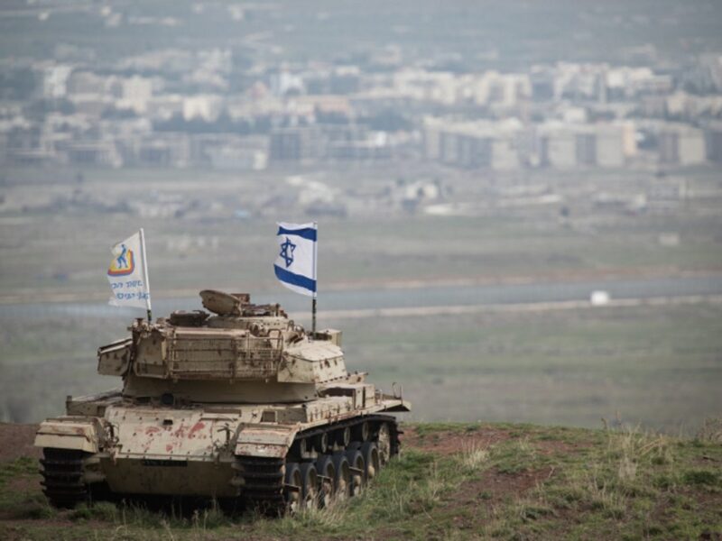 An old Israeli tank with a flag overlooking the Syrian town of Quneitra in the Golan Heights on Feb. 11, 2018. Photo by Hadas Parush/Flash90.