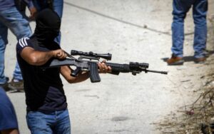 Palestinian gunmen from the Al-Aqsa Martyrs Brigades at the funeral of Malek Hamdan in the village of Salem near Nablus, May 15, 2021. Photo by Nasser Ishtayeh/Flash90.