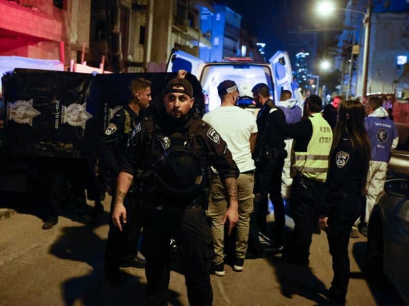 Israeli police officers and rescue forces are seen at the scene of a shooting attack in Bnei Brak, March 29, 2022. Photo by Olivier Fitoussi/Flash90