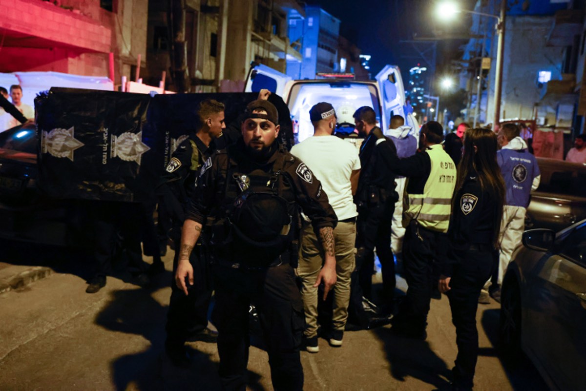 Israeli police officers and rescue forces are seen at the scene of a shooting attack in Bnei Brak, March 29, 2022. Photo by Olivier Fitoussi/Flash90