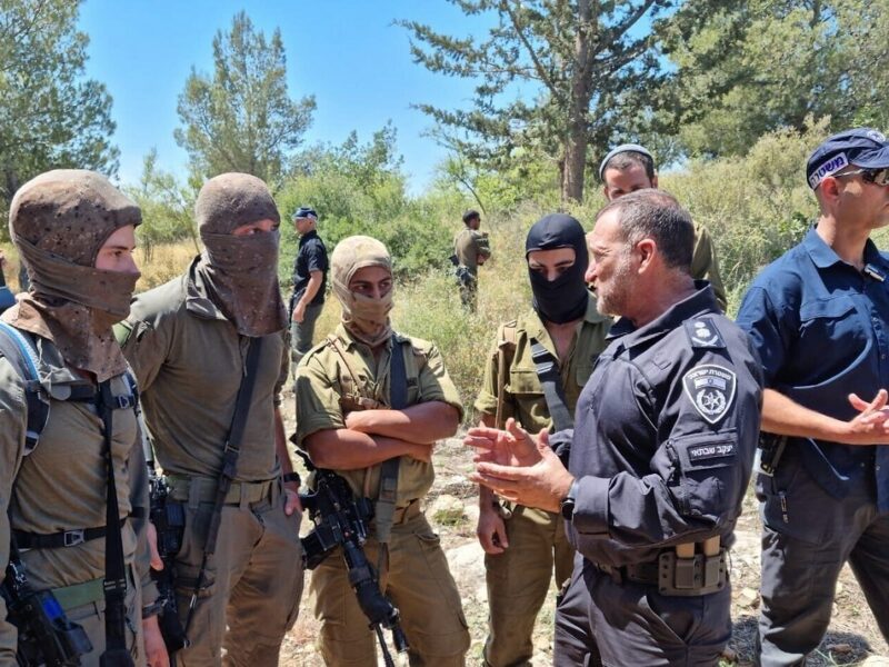 Israel Police Commissioner Yaakov Shabtai (second from right) talks with members of the Israeli forces participating in the search for the terrorists who murdered three people in the city of Elad on May 5, 2022, in this image posted on social media on May 8, 2022. Source: Israel Police Twitter.