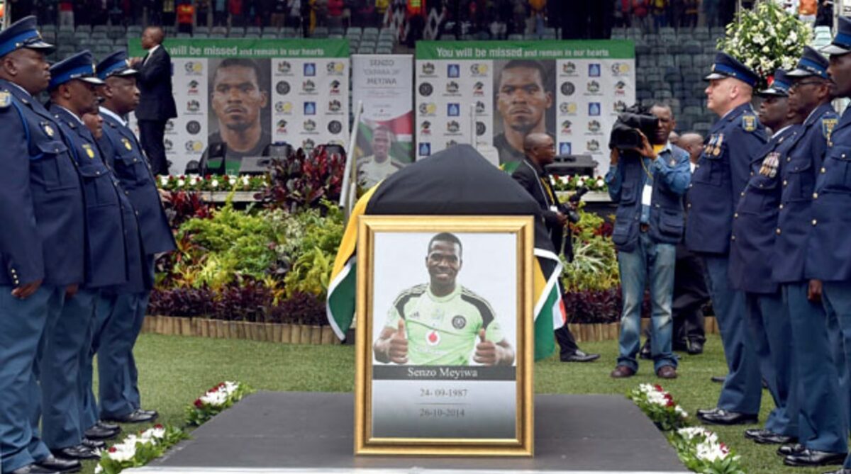 Senzo Meyiwa's funeral, 1 Nov 2014. Police inspect a guard of hunour for Senzo Meyiwa during the late Bafana Bafana and Orlando Pirates goalkeepr's funeral at Moses Mabhida Stadium. Source: GovZA, Flickr.