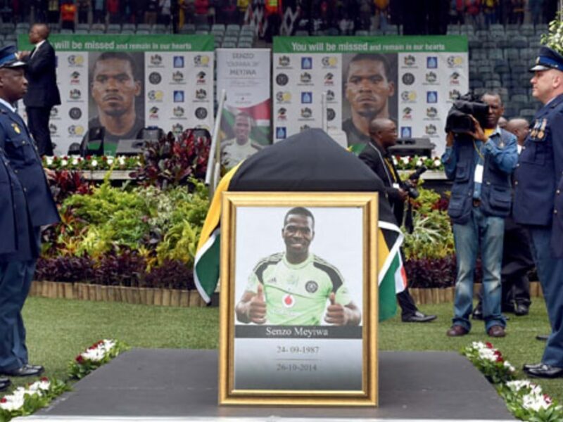 Senzo Meyiwa's funeral, 1 Nov 2014. Police inspect a guard of hunour for Senzo Meyiwa during the late Bafana Bafana and Orlando Pirates goalkeepr's funeral at Moses Mabhida Stadium. Source: GovZA, Flickr.