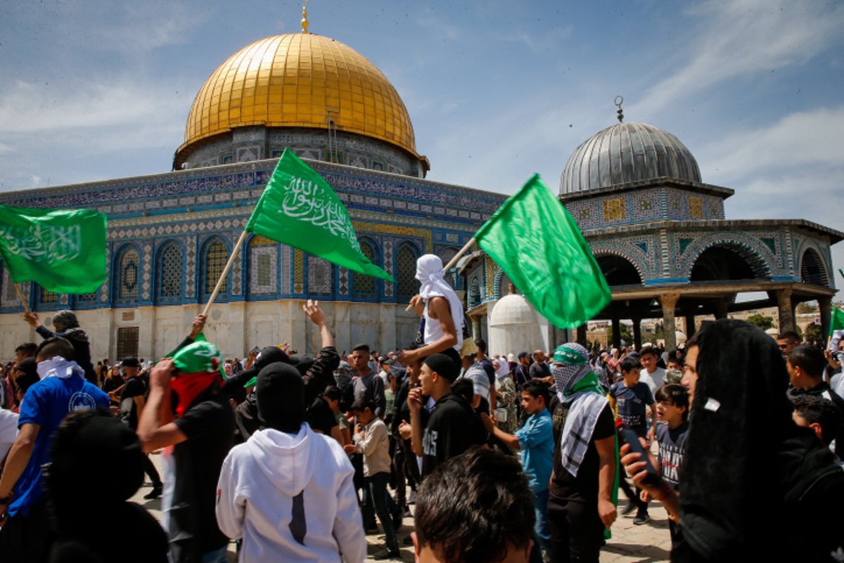 Protesters wave Hamas flags after Friday prayers of the holy month of Ramadan, at the Al Aqsa Mosque Compound in Jerusalem's Old City, Friday, April 22, 2022. Photo by Jamal Awad/Flash90.