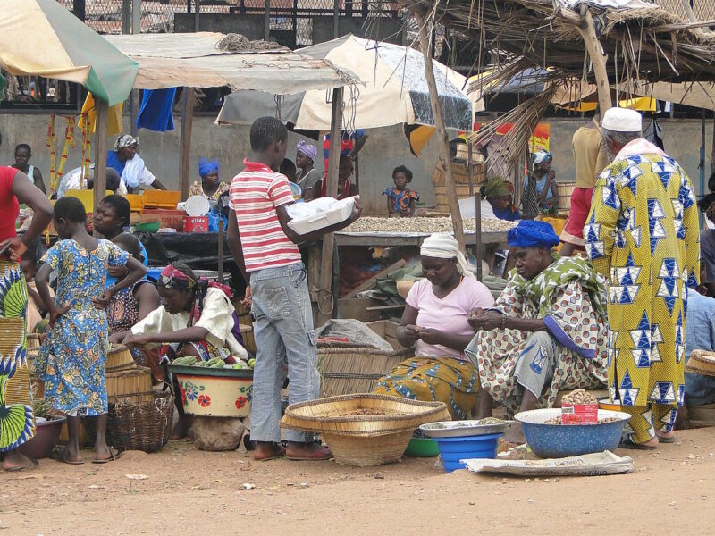 Market Scene - Gaoua - Burkina Faso. By Adam Jones, Ph.D. Commons.
