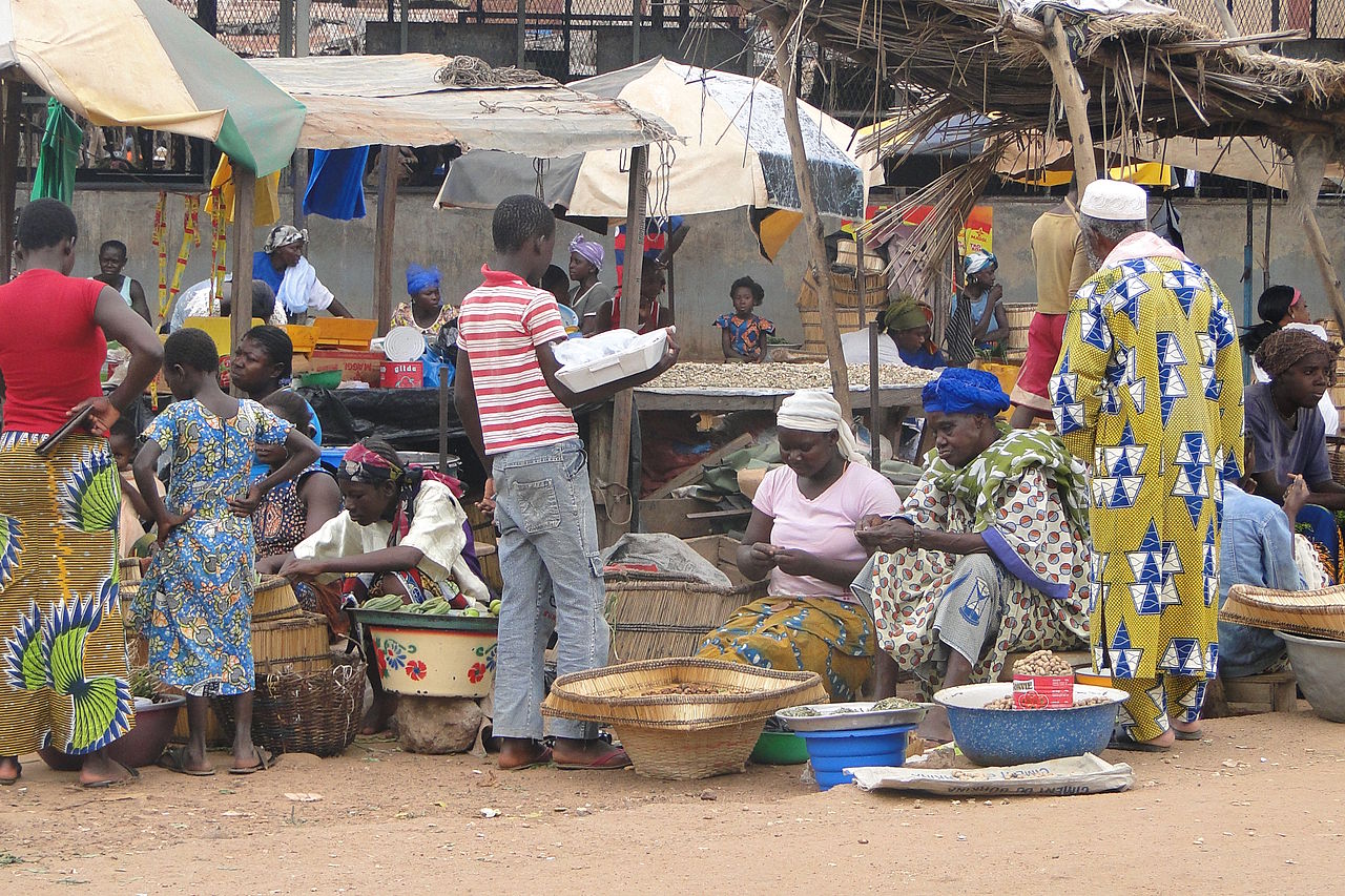 Market Scene - Gaoua - Burkina Faso. By Adam Jones, Ph.D. Commons.