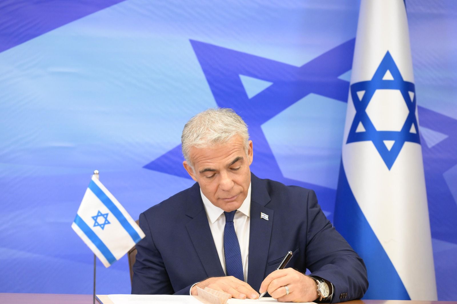 Israeli Prime Minister Yair Lapid signs the U.S.-mediated maritime border and natural gas deal with Lebanon, October 27, 2022. Credit: Amos Ben-Gershom/GPO.