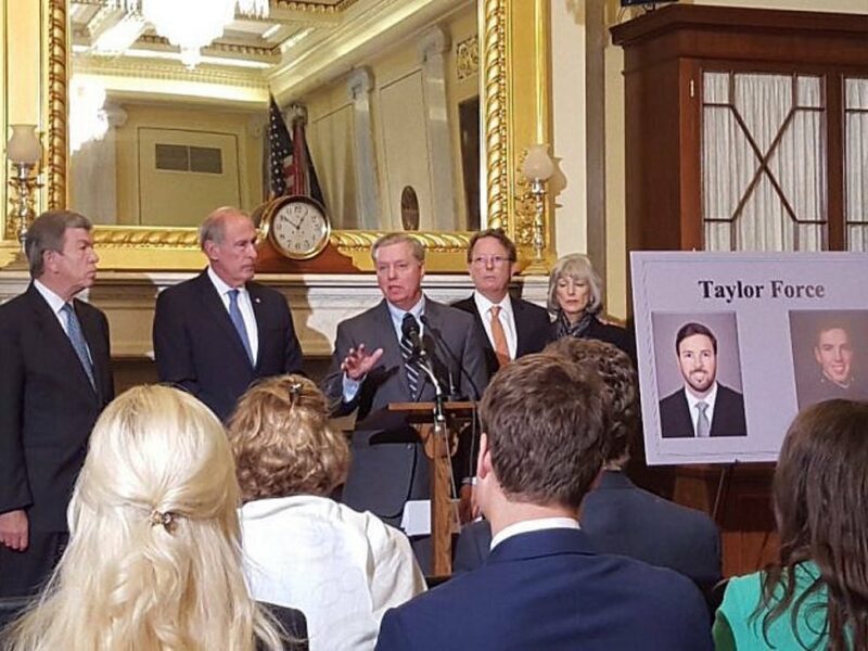 The Taylor Force Act being introduced by Sen. Lindsey Graham (R-S.C.), Sen. Dan Coats (R-Ind.) and Sen. Roy Blunt (R-Mo.) in 2016. Taylor Force’s father, Stuart Force is pictured at the center-right. Source: Twitter.